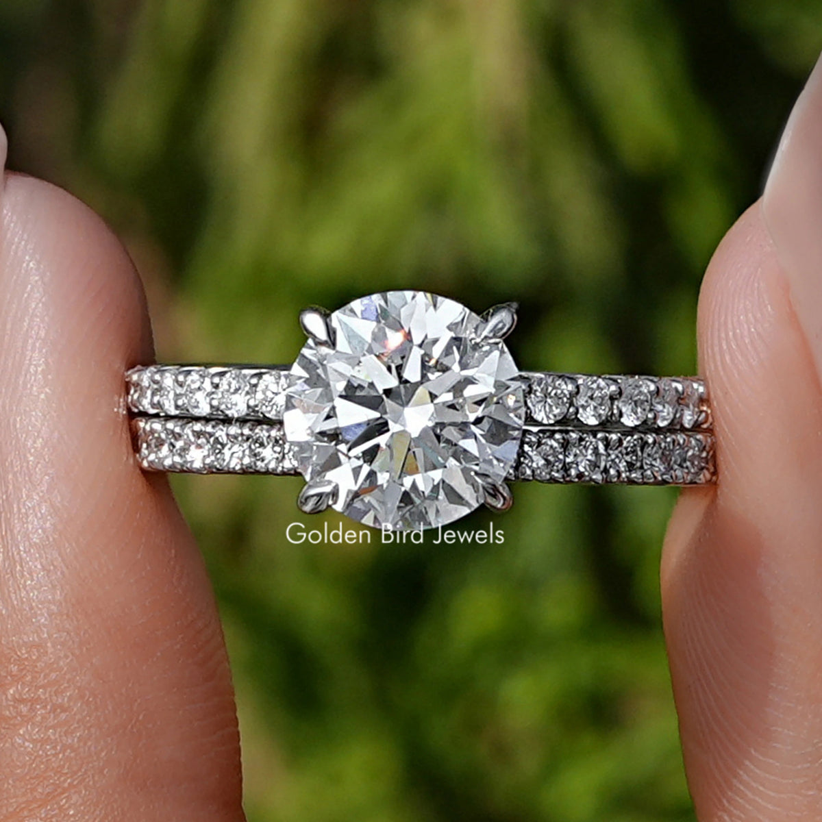 Round Cut Lab Grown Diamond Wedding Ring held between fingers