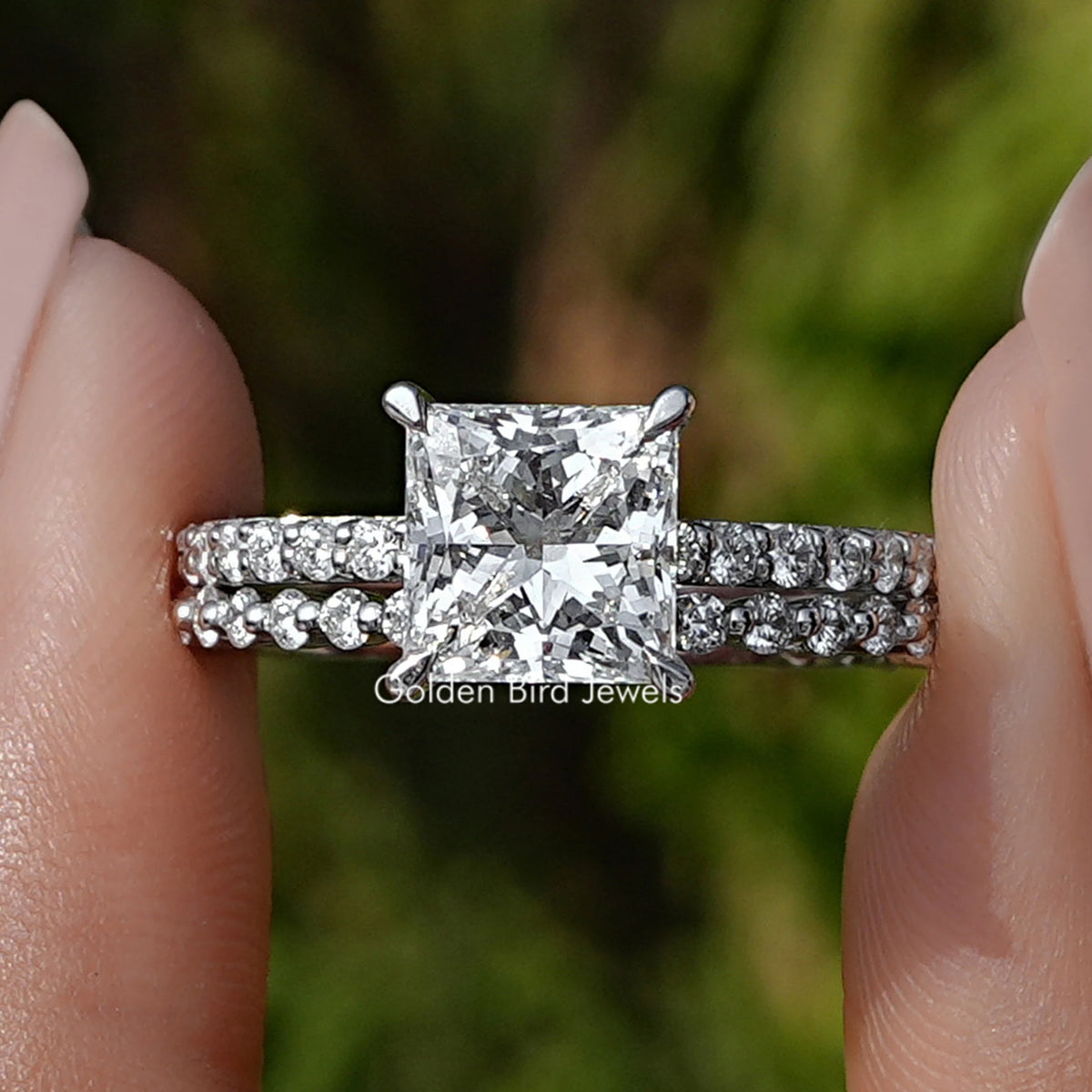 Princess Cut Lab Grown Diamond Ring Held Between Fingers