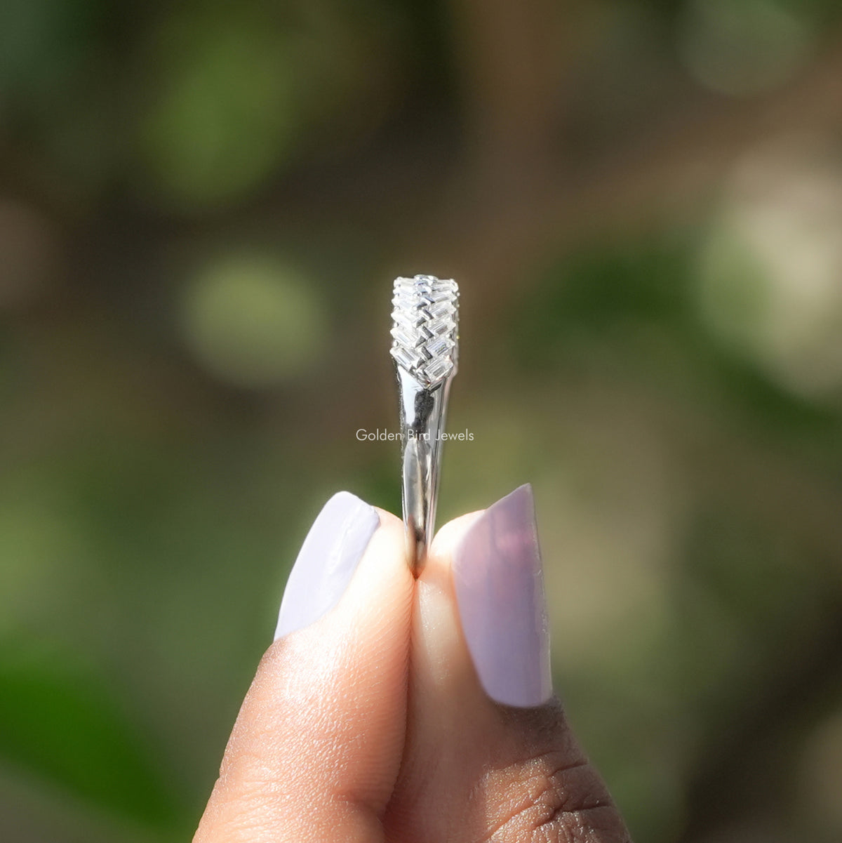 Side View of Baguette Cut Moissanite Half Eternity Band In two fingers