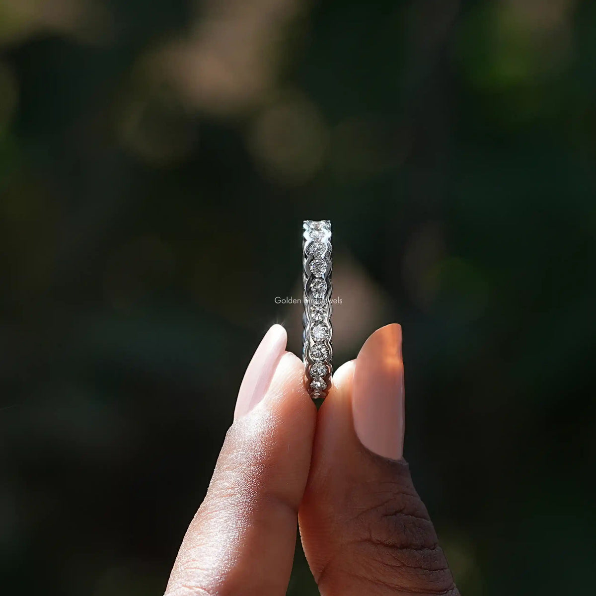 Side View of Round Diamond Wedding Band In two fingers