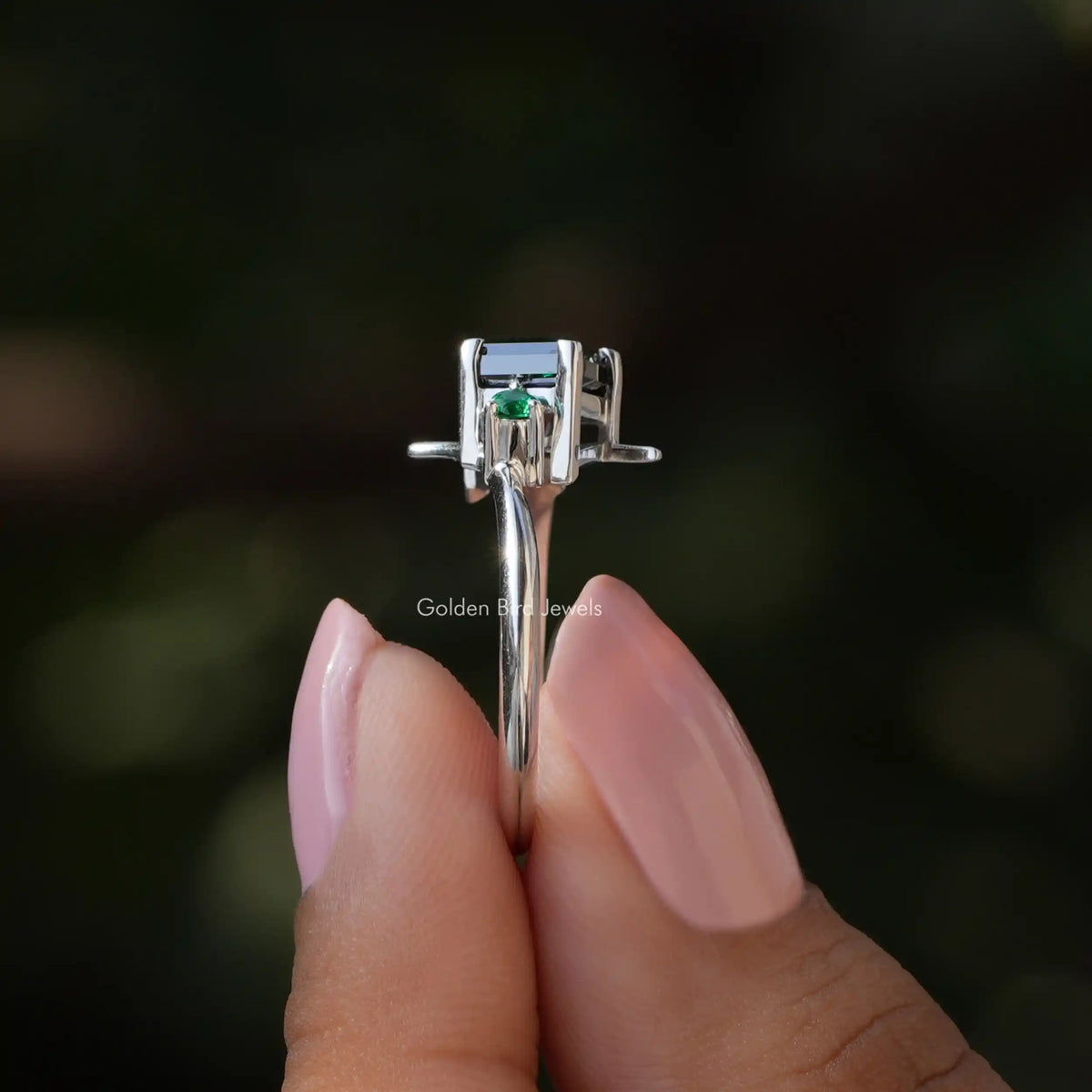 Side View of Kite Cut Moissanite Engagement Ring In two fingers