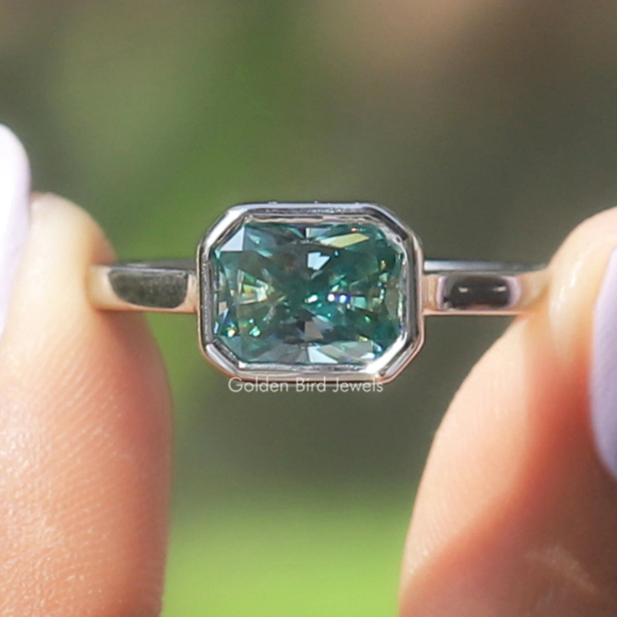 Front view of Blue Radiant Cut Moissanite Engagement Ring