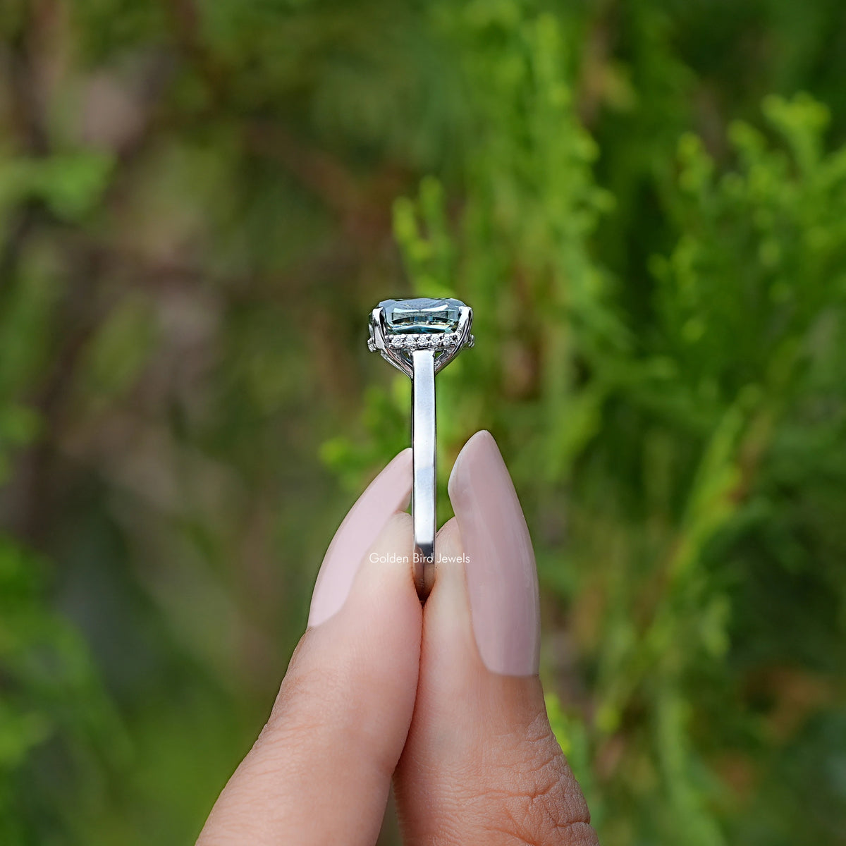 Side View of Fancy Green Elongated cushion moissanite hidden halo ring