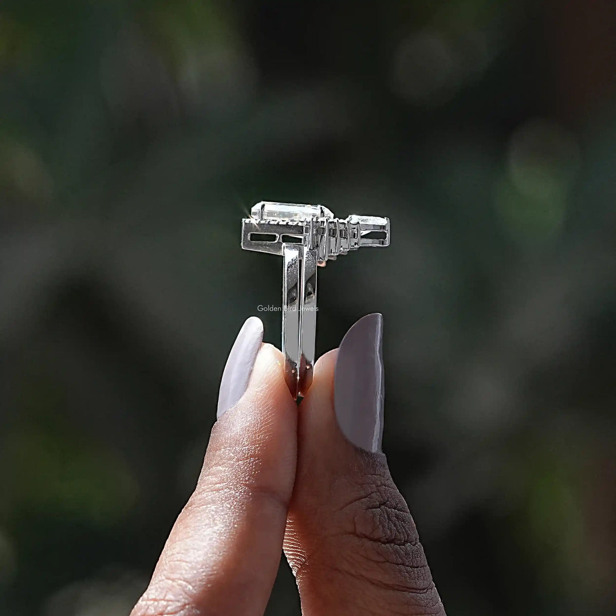 Side View of Coffin Cut Moissanite Halo Bridal Ring Set In two fingers