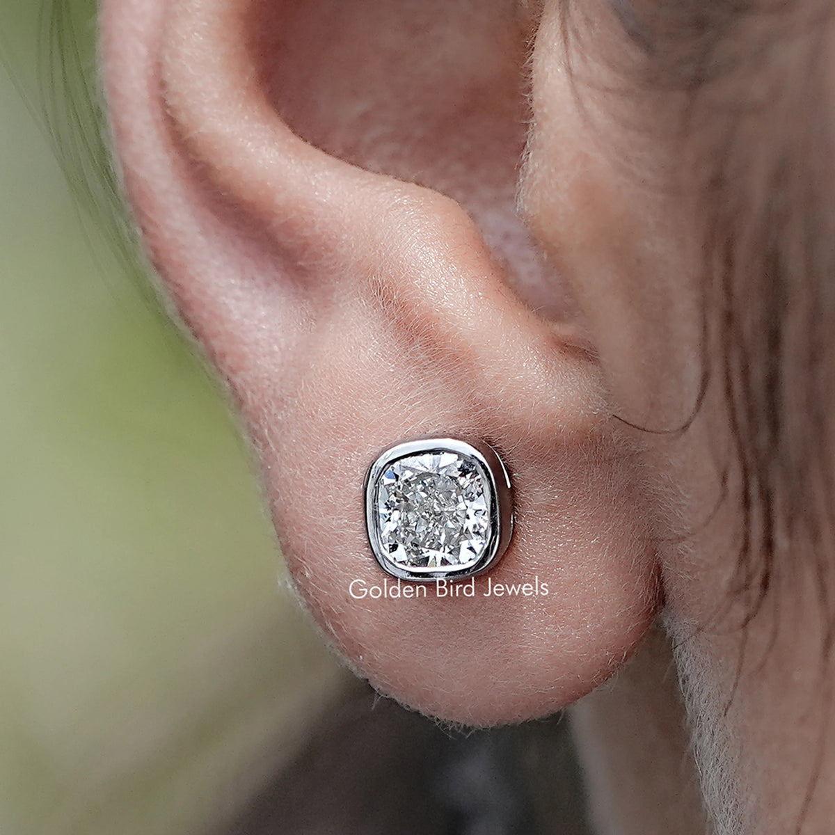Close up view of Cushion Cut Lab Diamond Bezel Set Stud Earrings