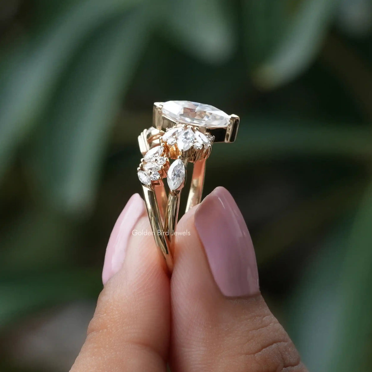 Side View Of Marquise Cut Moissanite Engagement Ring In two finger