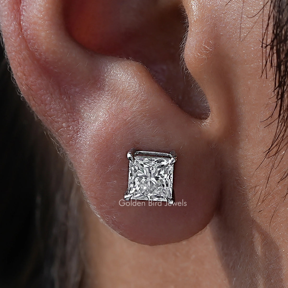 Close Up View Of Princess Cut Diamond Solitaire Stud Earrings