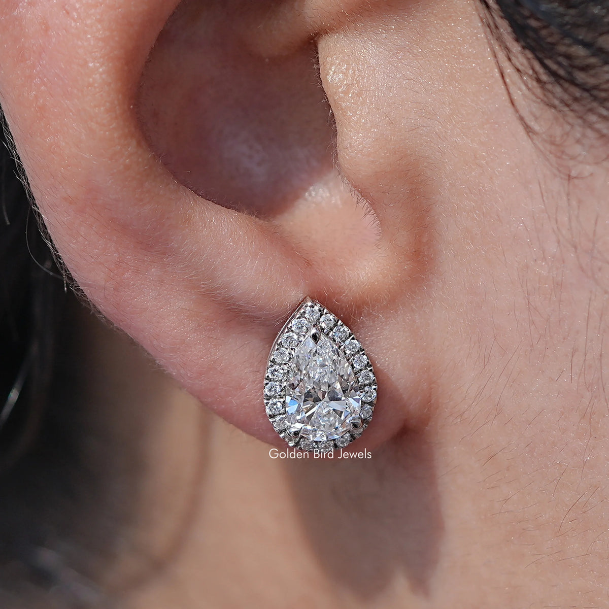 Close up view of Pear Lab Diamond Cut Halo Earrings