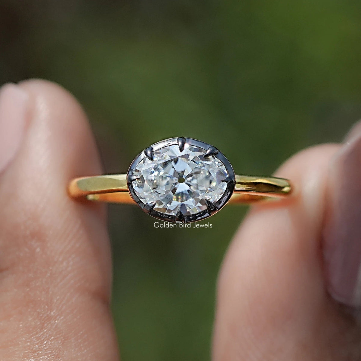Front view of East West Old Mine Oval Cut Moissanite Solitaire Ring