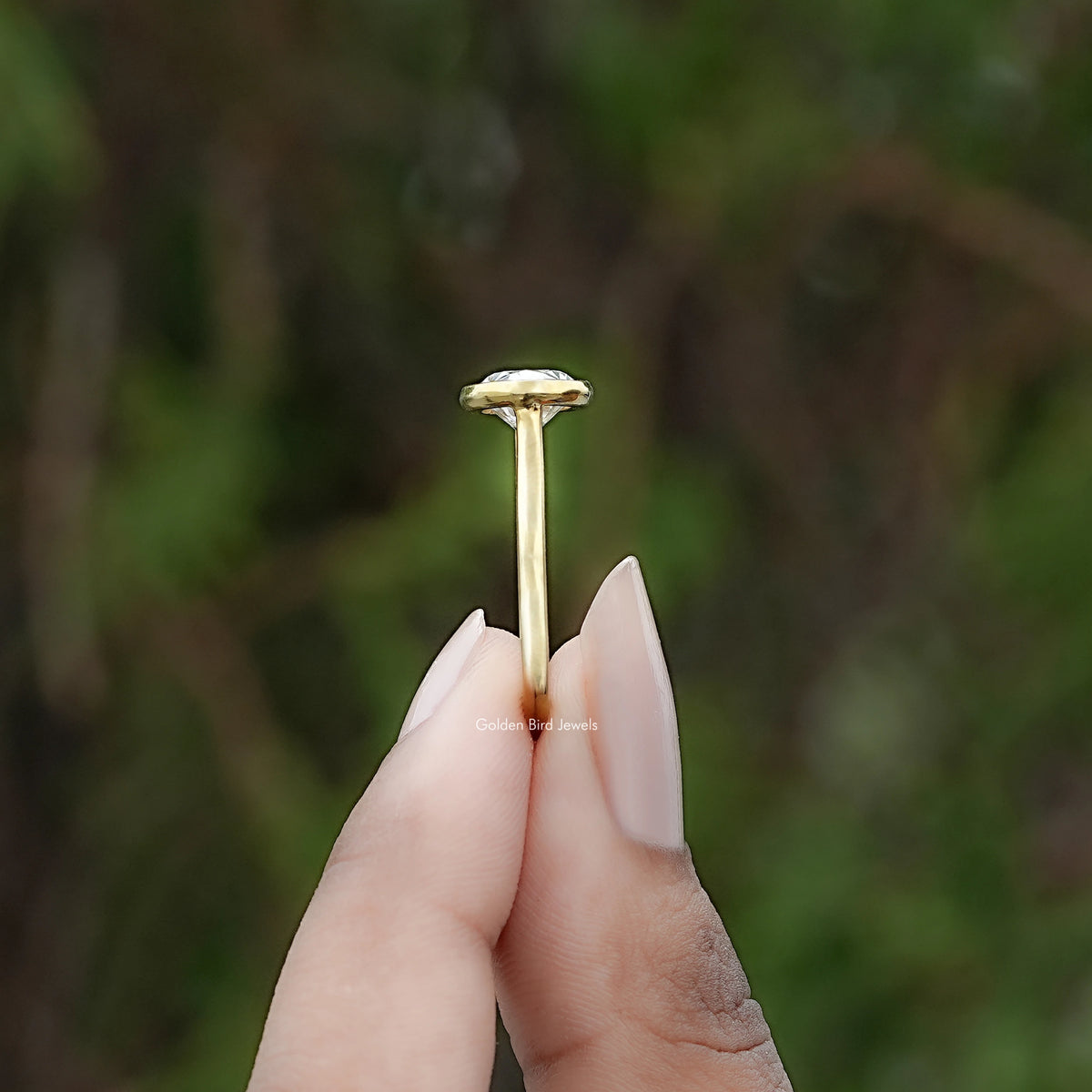 Side View of East West Oval Diamond Bezel Set Ring