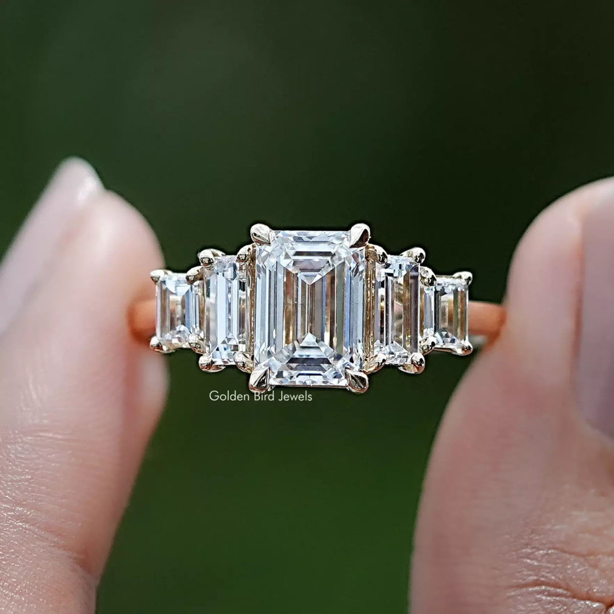 Emerald And Baguette Lab Diamond Five Stone Ring In Two Fingers