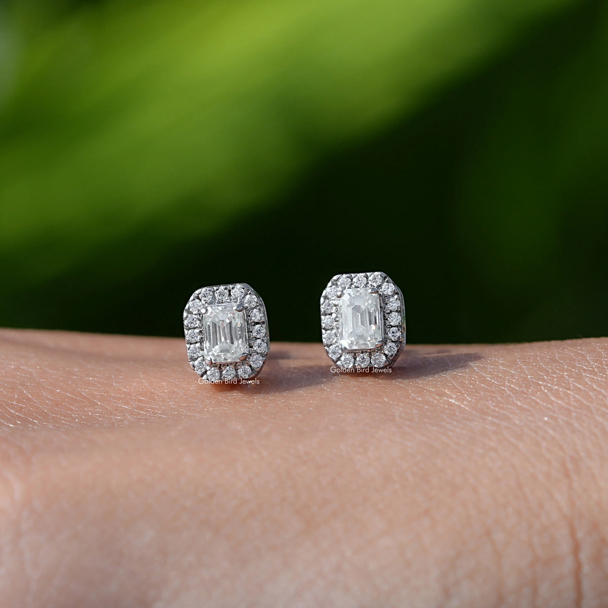 In Hand View Of emerald cut moissanite stud Earring