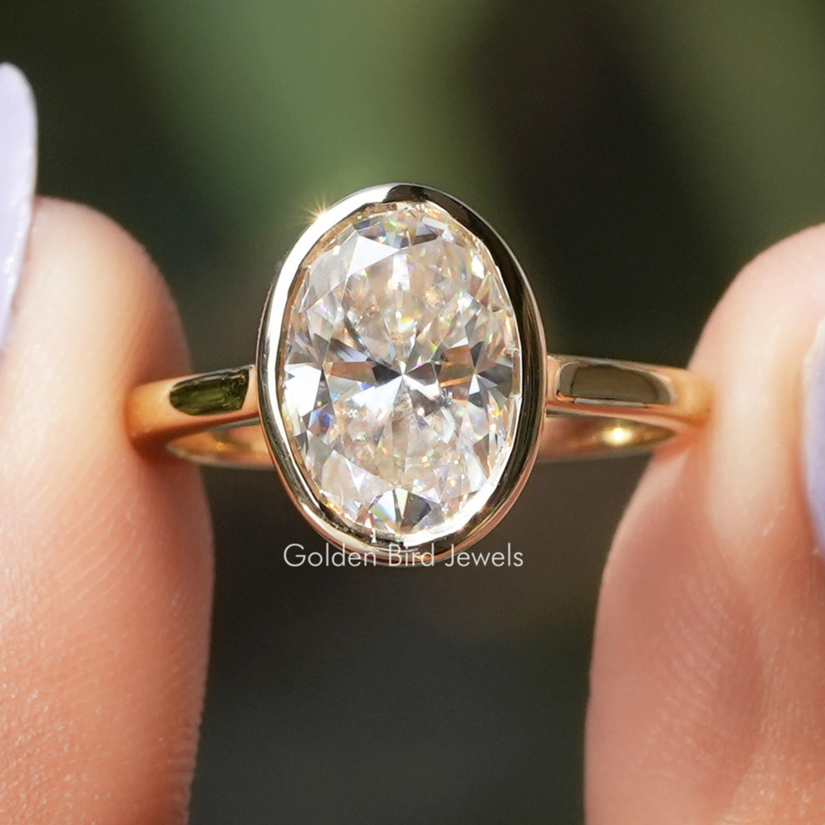 Oval Cut Moissanite Solitaire Bezel Set Ring
