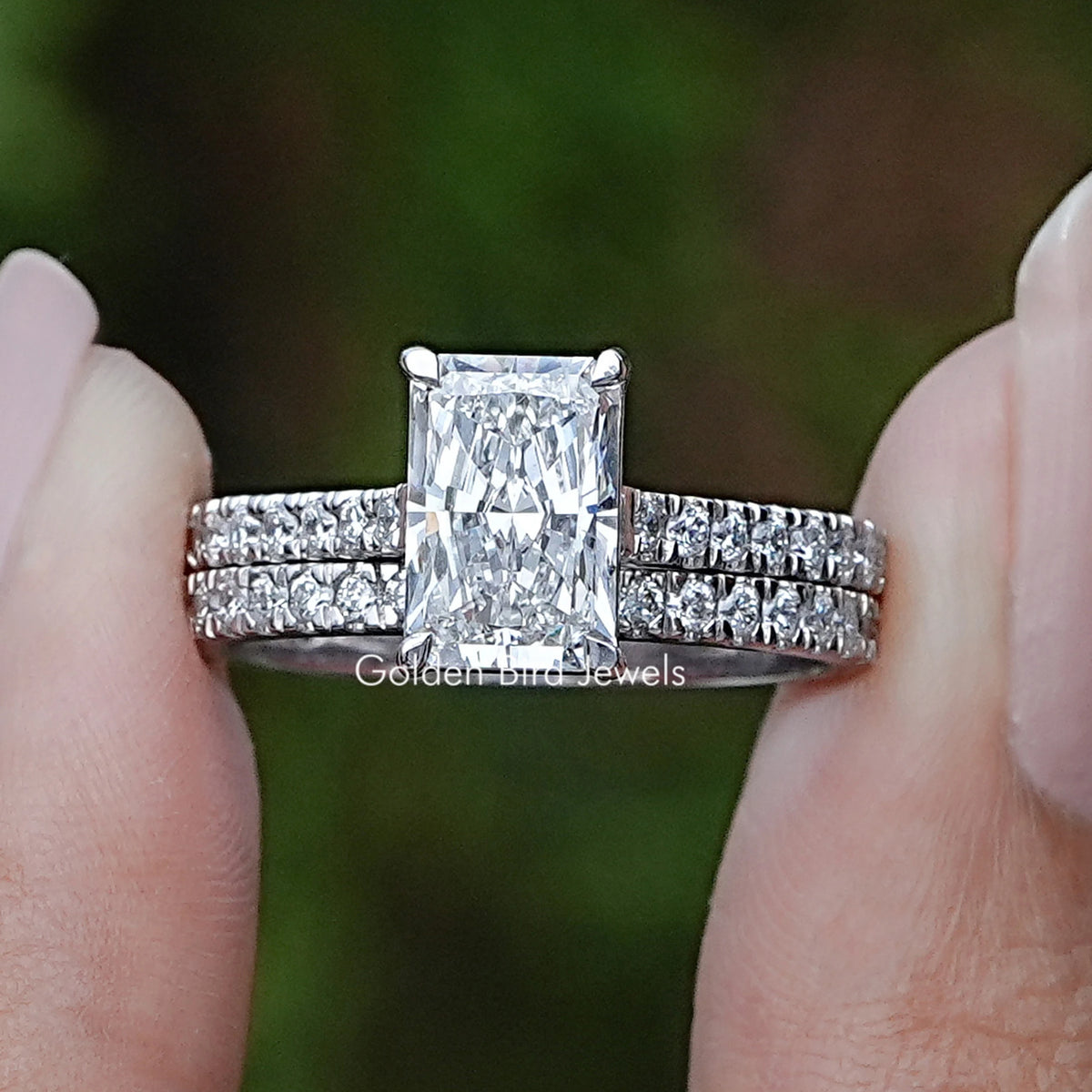Radiant Cut Lab Diamond Bridal Ring Set Held Between Fingers