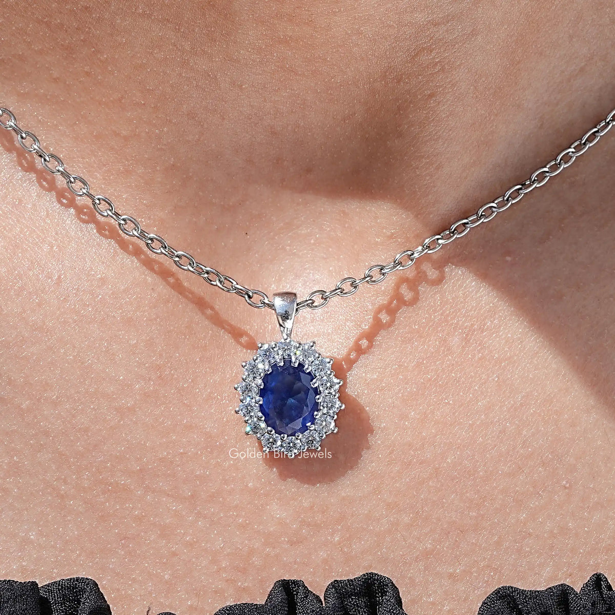 Close Up View of Blue Sapphire Oval Cut Halo Pendant Necklace