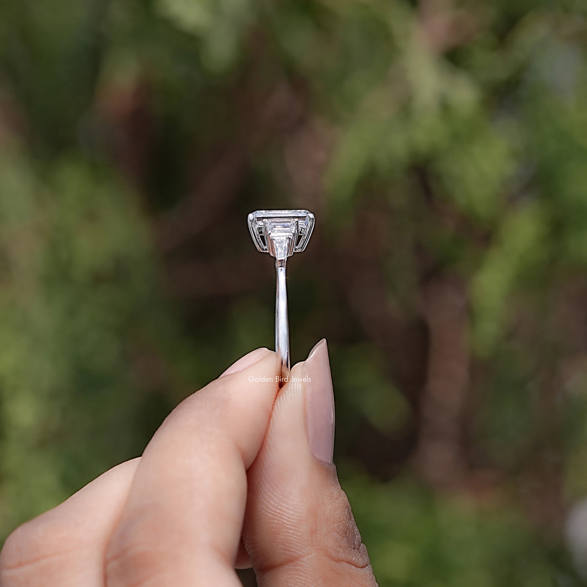 Side View of Emerald And Tapered Baguette Diamond Ring
