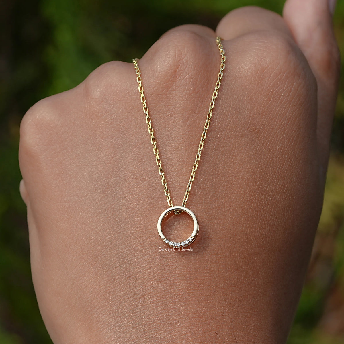 In Hand Holding the Round Cut Open Circle Pendant