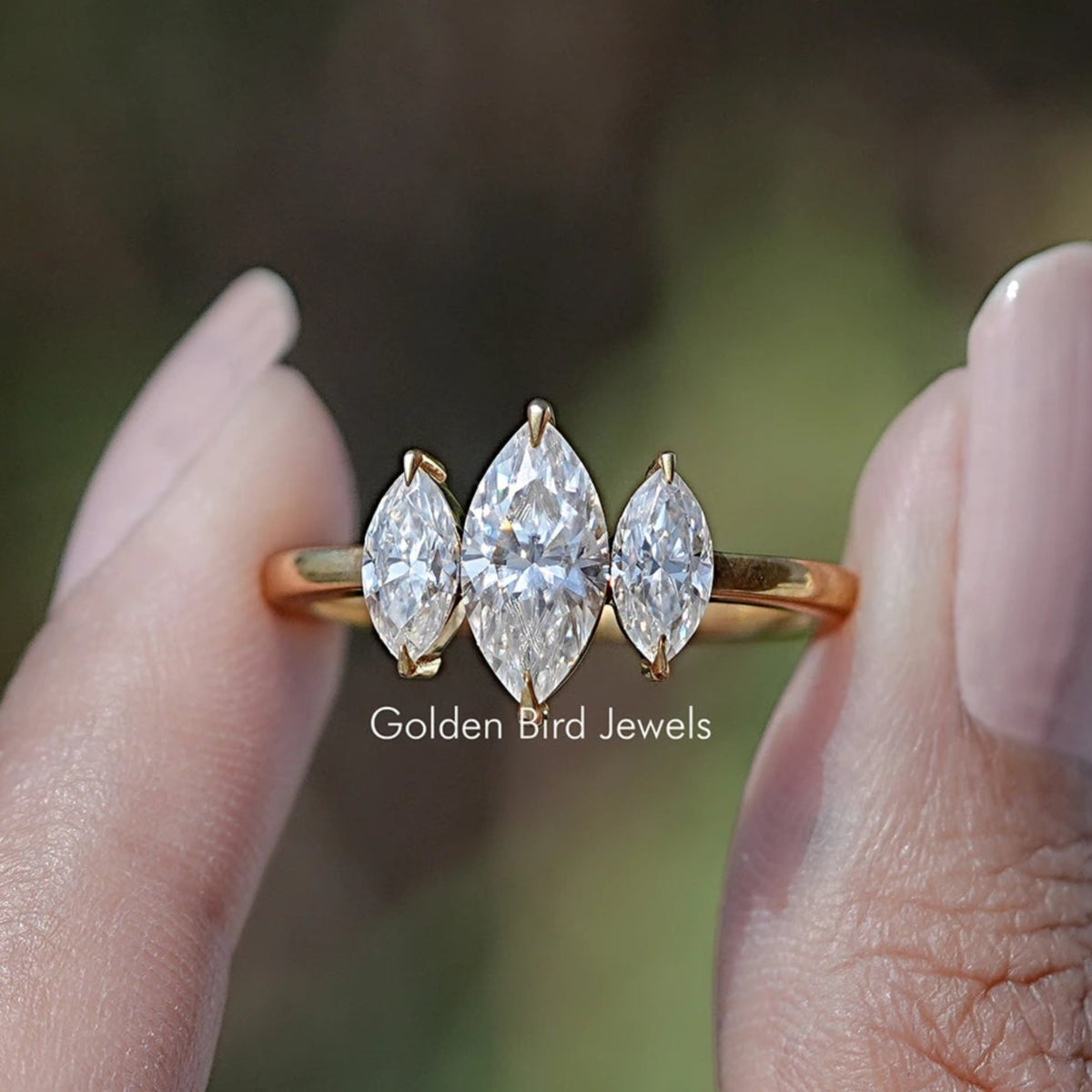 Front view of Marquise Moissanite Three Stone Engagement Ring