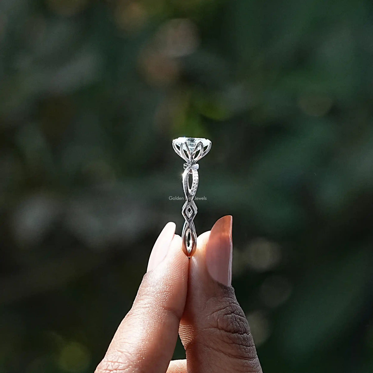 Side View of Oval Cut Twisted Shank Ring In two fingers