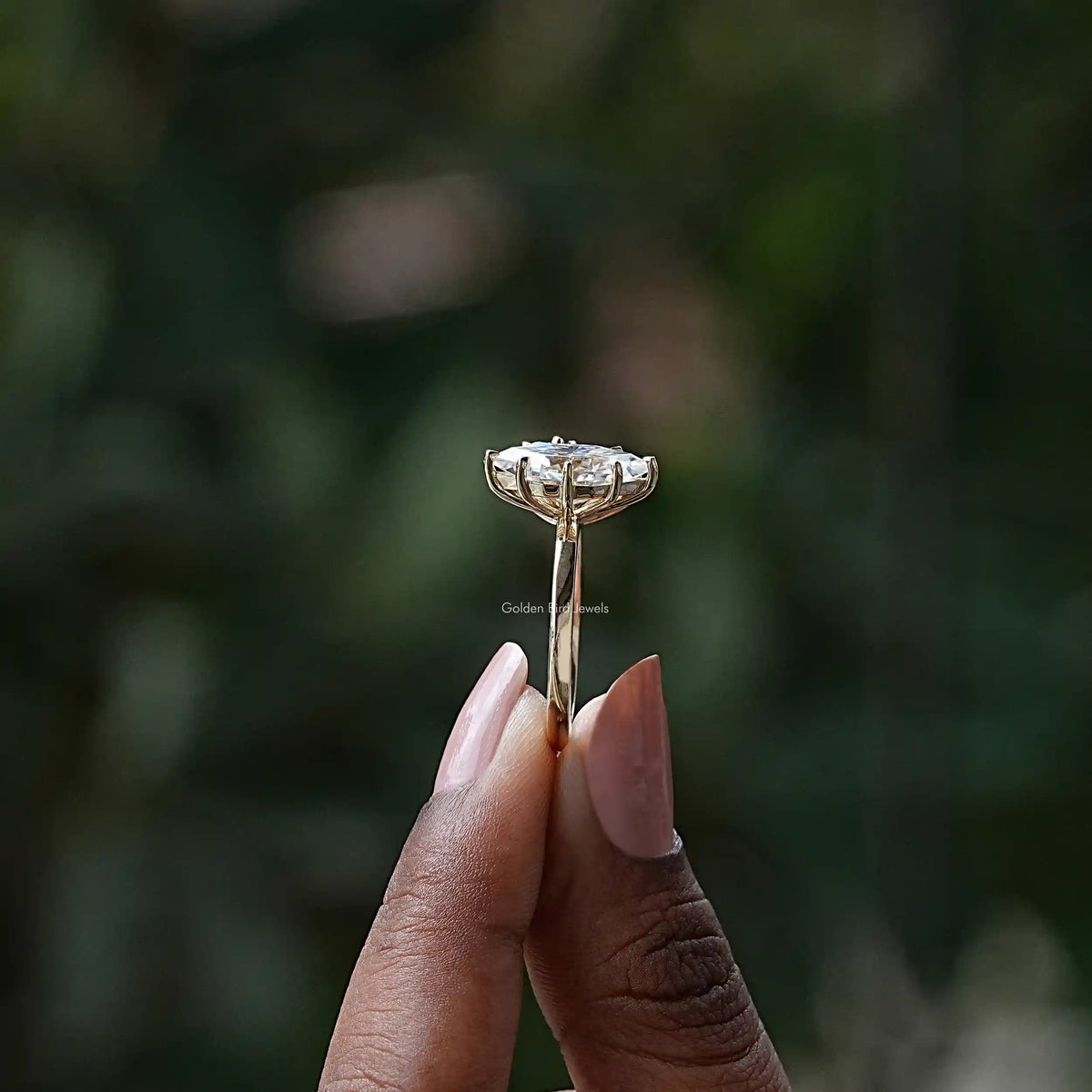 Side View of Pear And Dutch Marquise Toi Et Moi Ring In two fingers