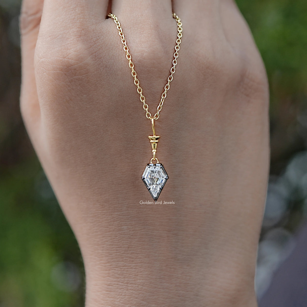 In hand Showing View Of Old Mine Shield Moissanite Pendant