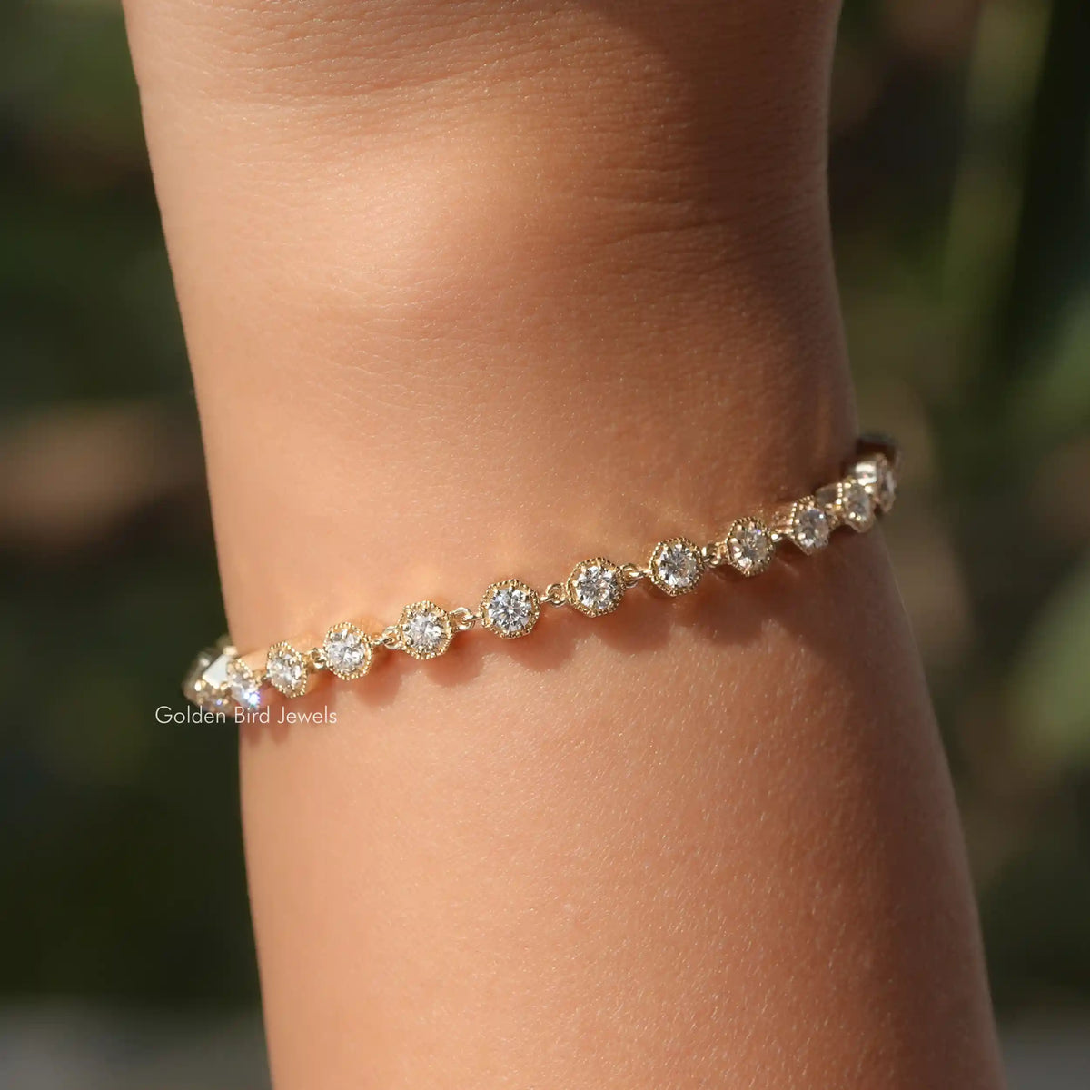 In hand showing view of moissanite bracelet
