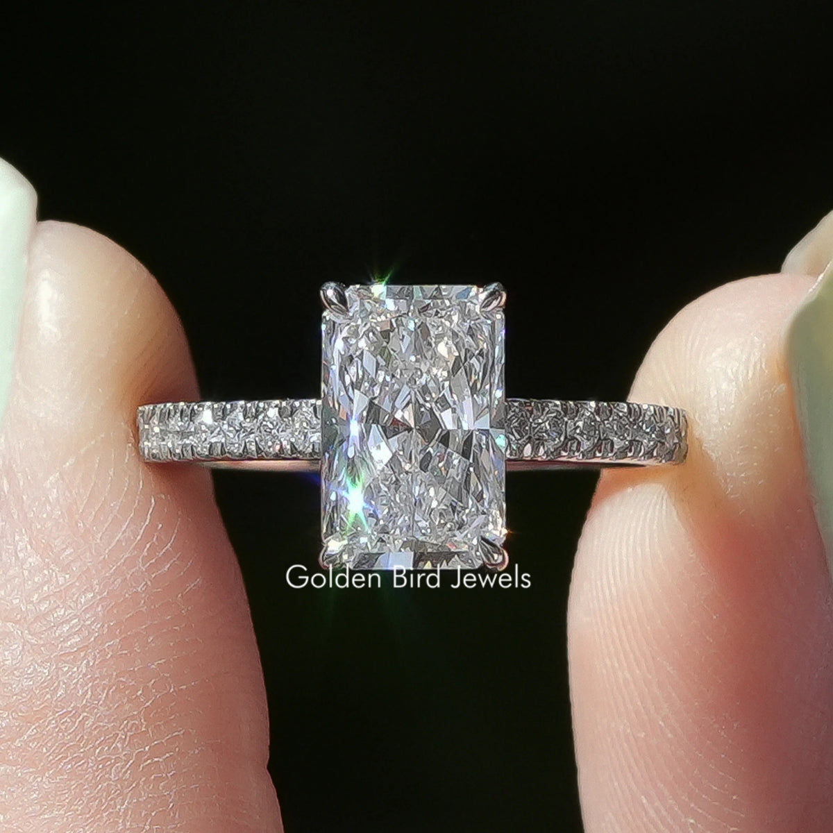 Radiant Cut Solitaire Diamond Ring  Held Between Fingers