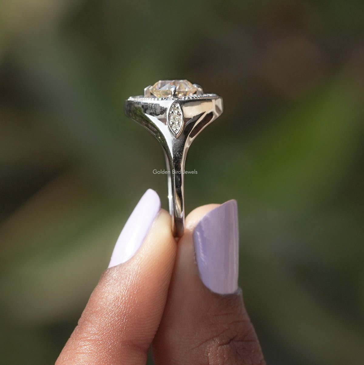 Side View of Old European Round Cut Moissanite Ring In two fingers