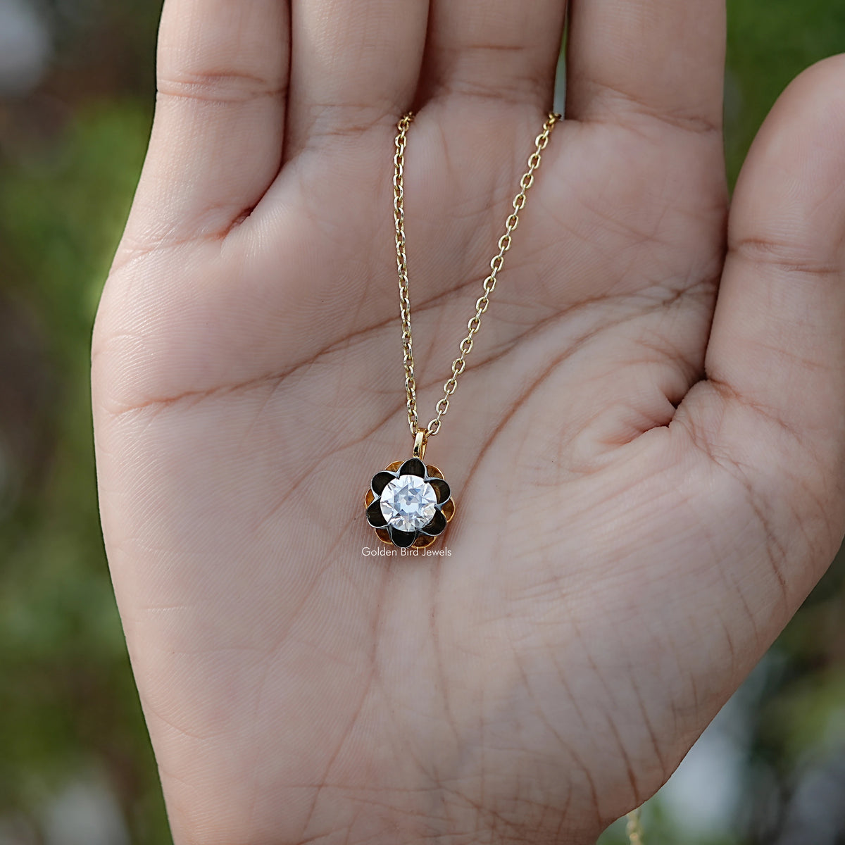 In hand Showing View Of Old European Cut Round Moissanite Flower Style Pendant
