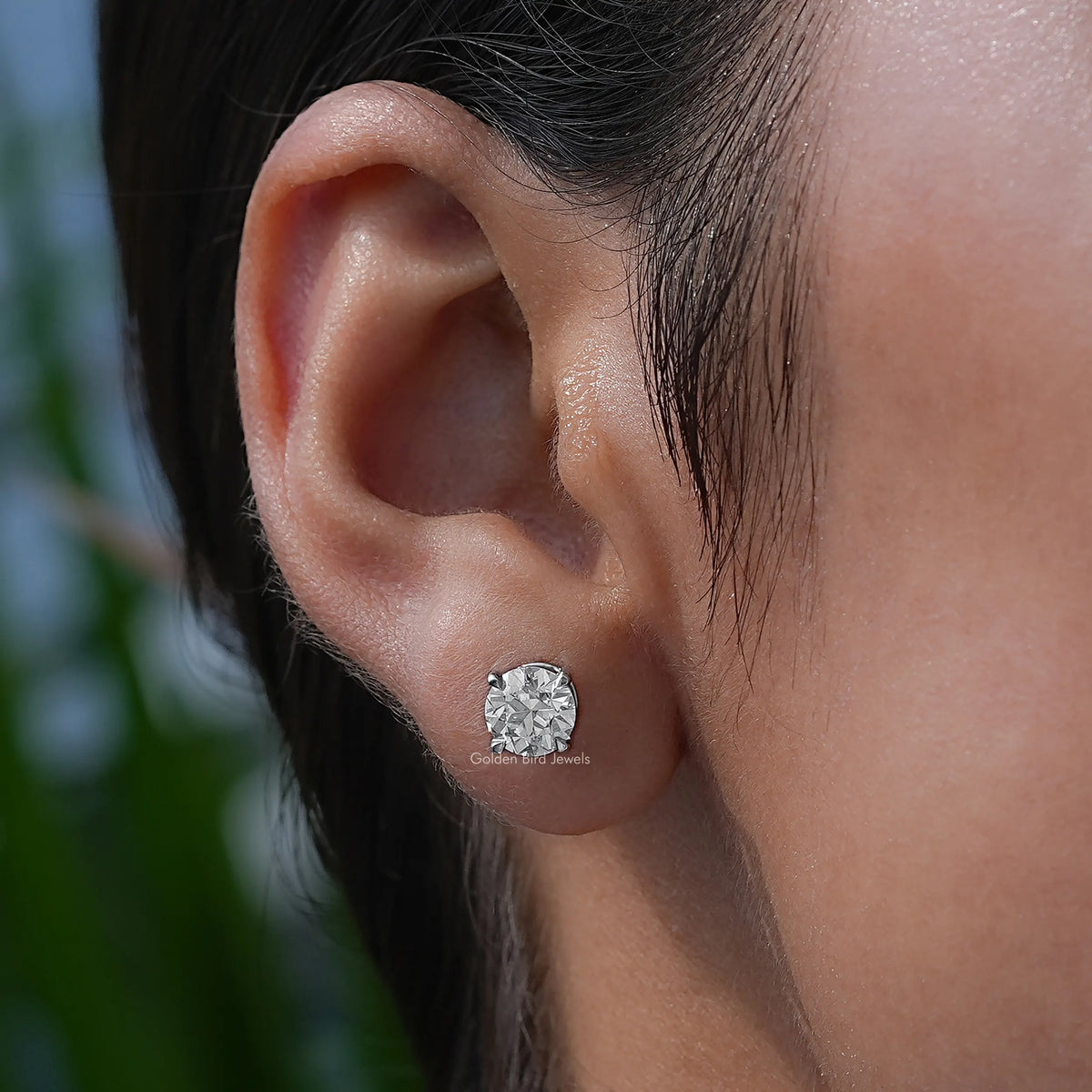 In-Ear View Of Diamond Stud Earrings in four prongs setting