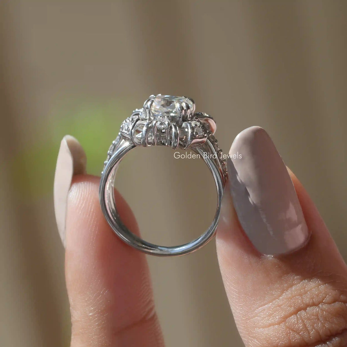 Back View of Old Mine Cushion Cut Accent Stone Ring In two fingers