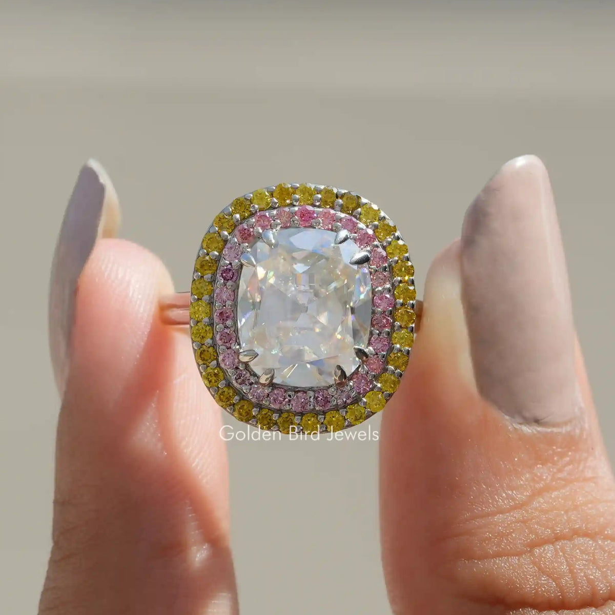 Front View of Old Mine Cushion Cut Moissanite Ring In two Fingers