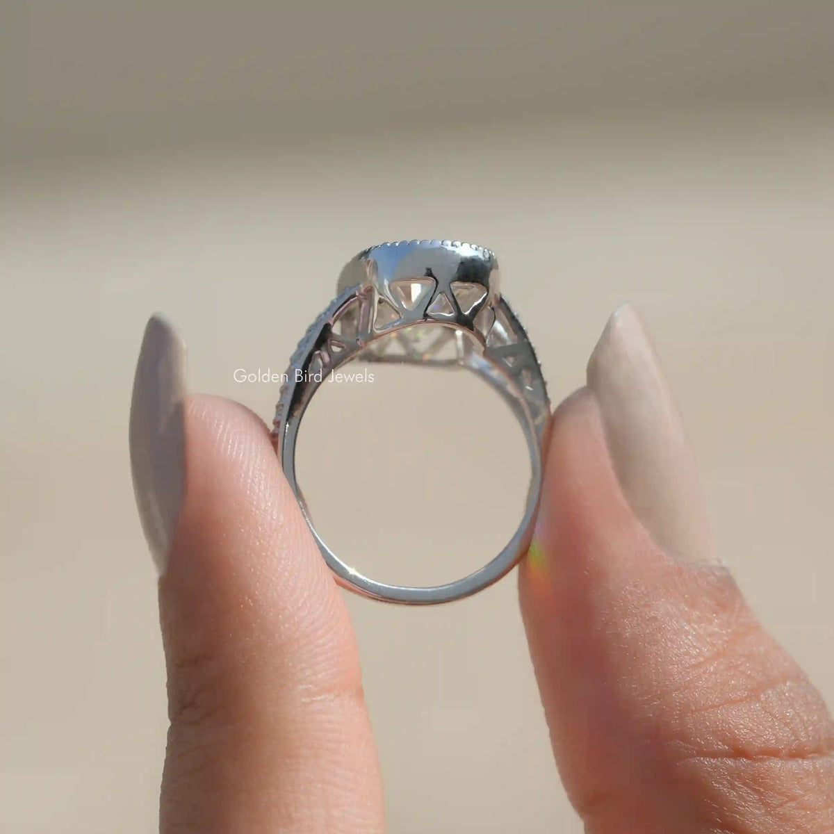 Back View of Moissanite Ring Made Of Old Mine Oval Cut In two fingers