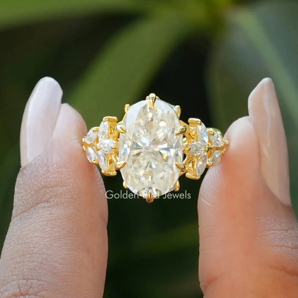 Front View of Oval And Marquise Cut Moissanite Ring In two Fingers