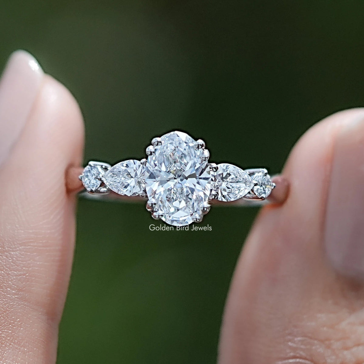 Oval And Pear Lab Diamond Five Stone Engagement Ring In Two Fingers