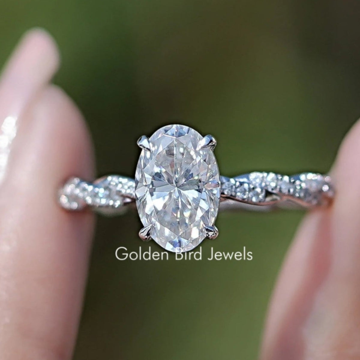 Front view of Oval Shaped Moissanite Twisted Shank Accent Ring