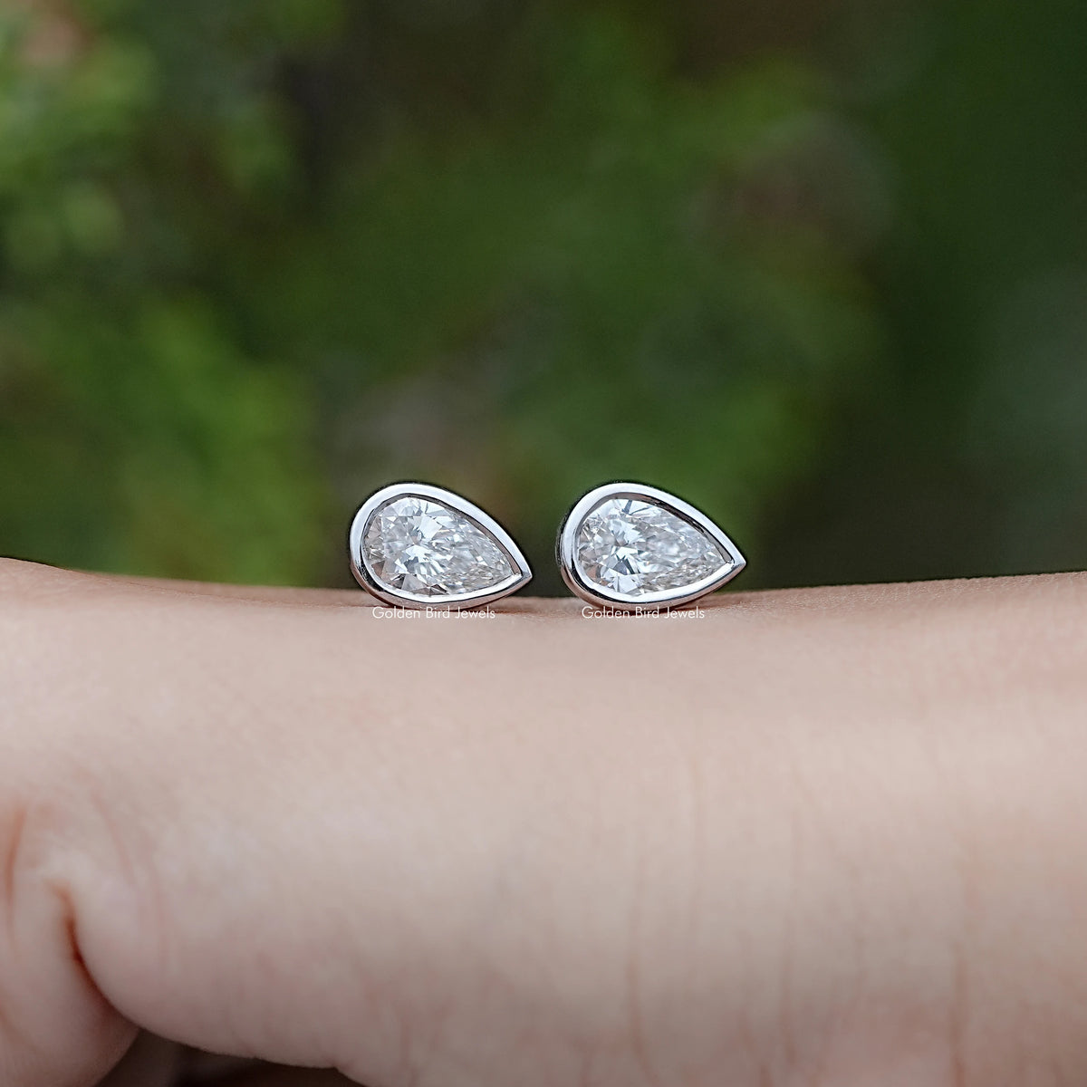 Front view of Lab Diamond Pear Shaped Bezel Set Stud Earrings