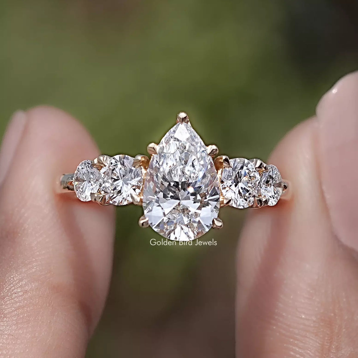 Pear Cut Lab Grown Diamond Five Stone Ring in Two Fingers