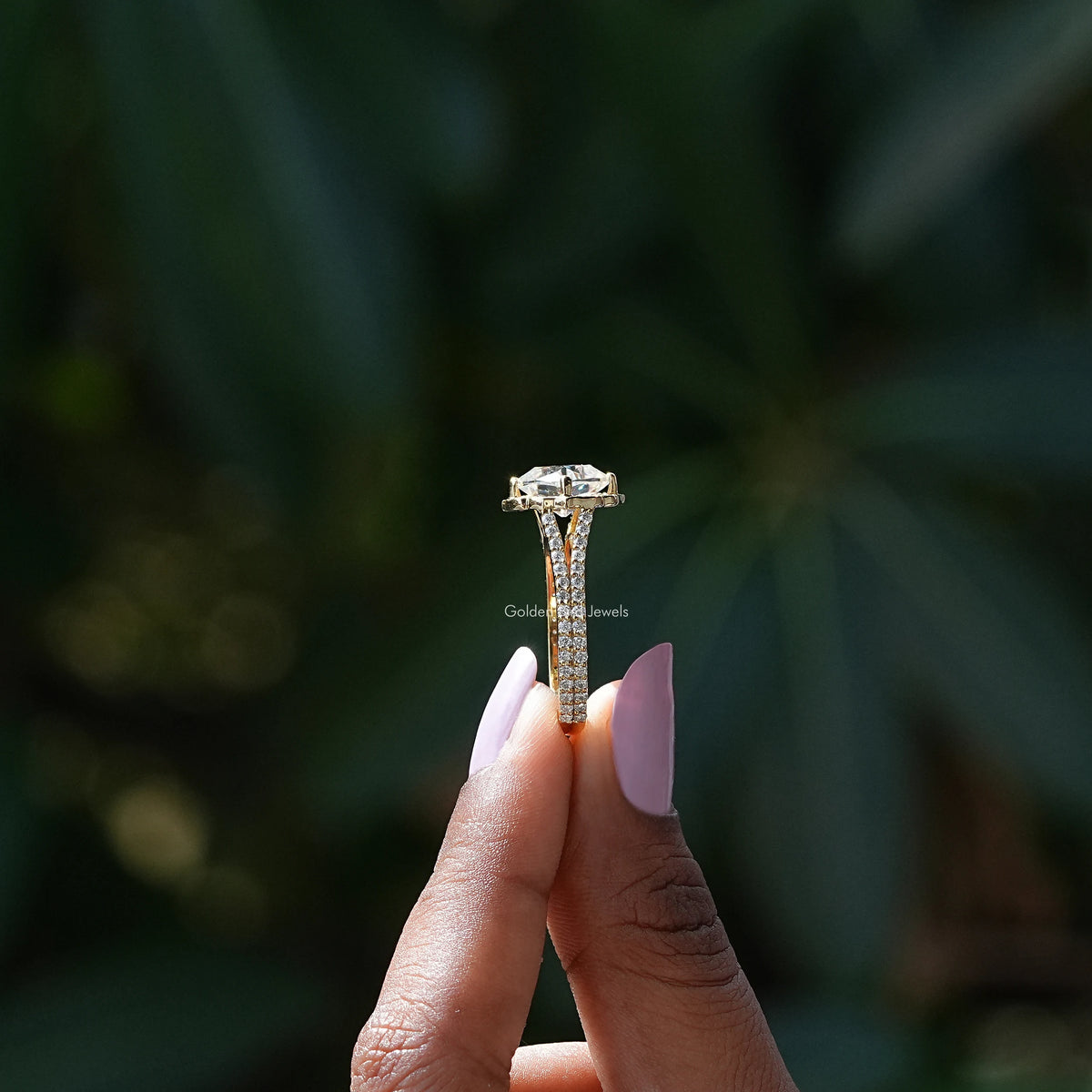 Side View of Round And Peruzzi Cut Moissanite Ring In two fingers