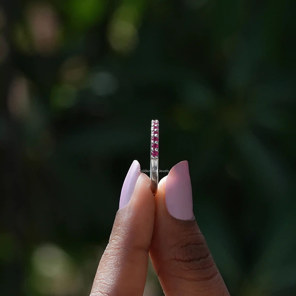 Side view of October Birthstone Pink Tourmaline Round Eternity Band