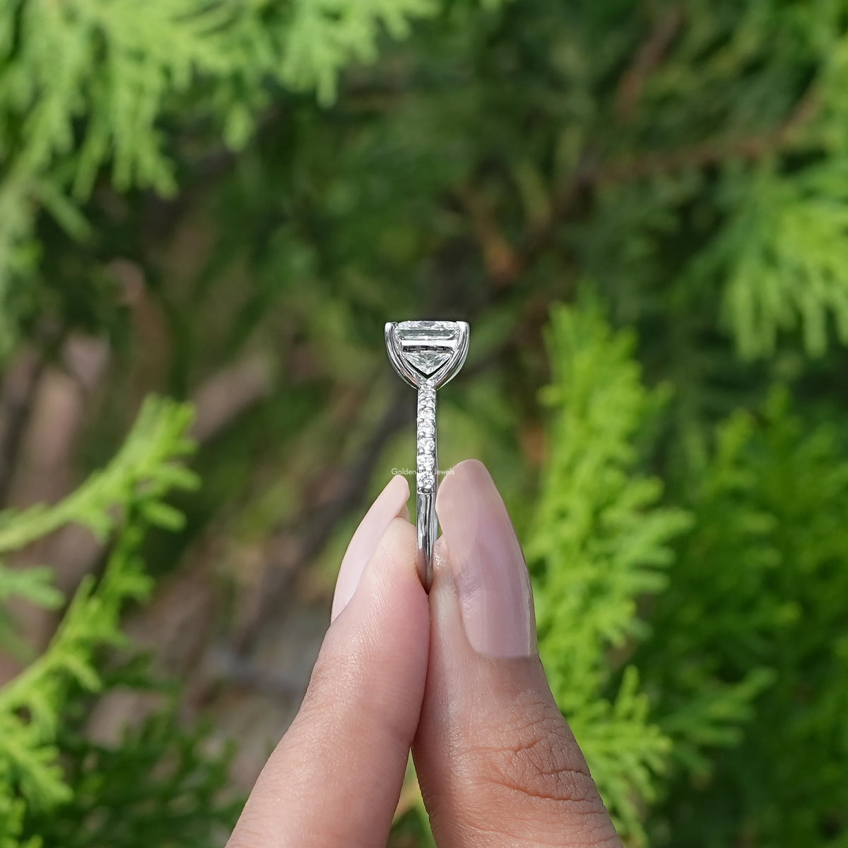 Side View of Princess Cut Diamond Solitaire Ring In two fingers