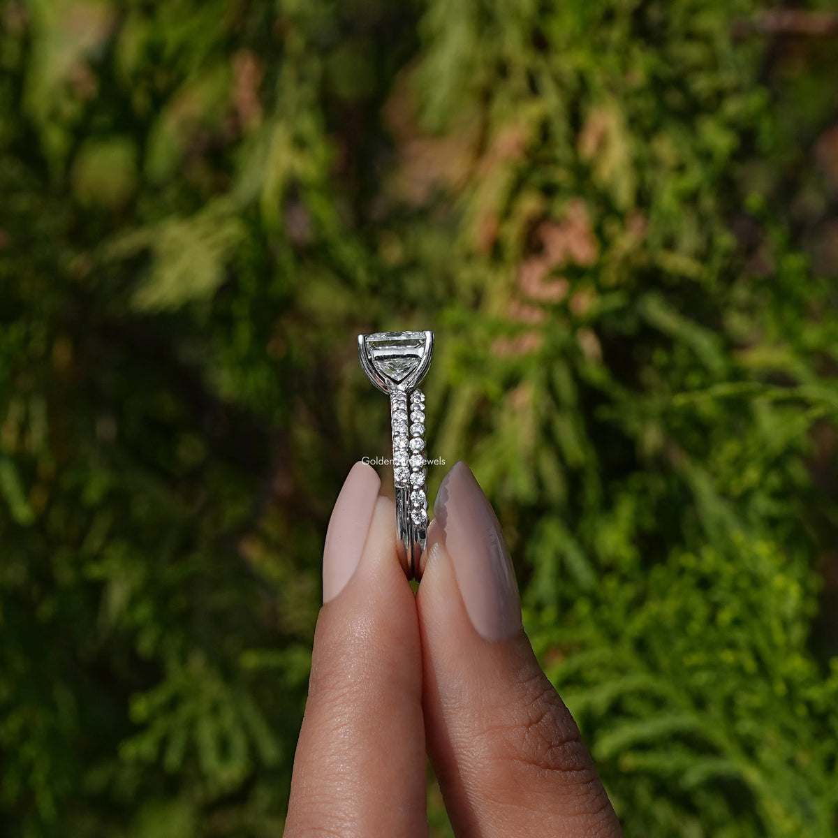 Side View A Princess Cut Lab Diamond Ring in a two fingers