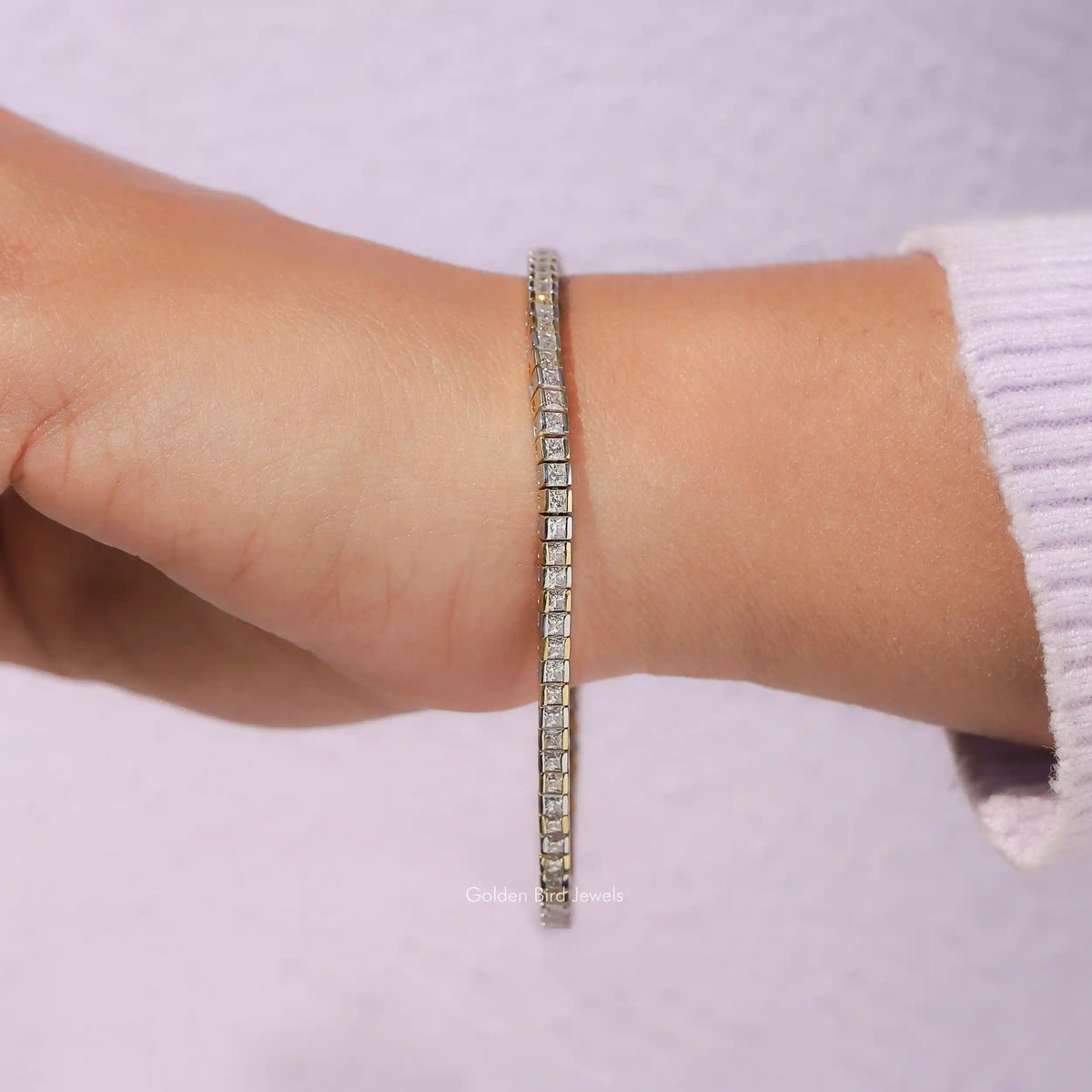 In hand view of princess cut moissanite halo bracelet