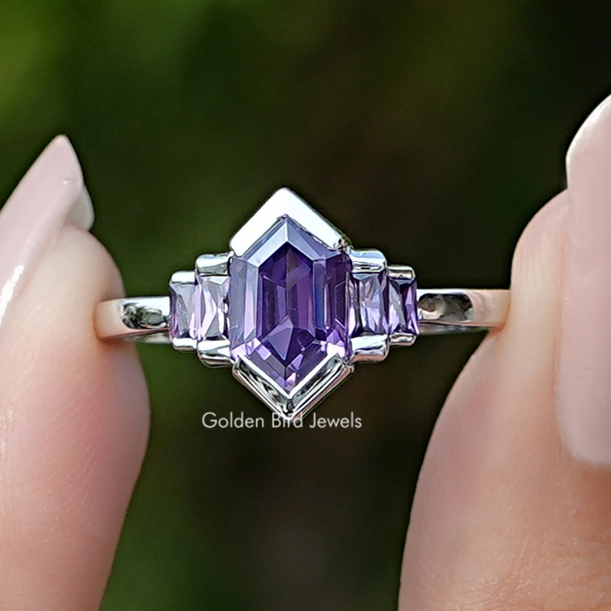 Front view of Purple Amethyst Hexagon Gemstone Bezel Ring Set in two fingers