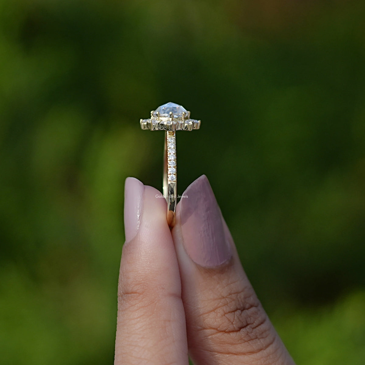 Side View of Rose Cut Round Halo Moissanite Ring In two fingers