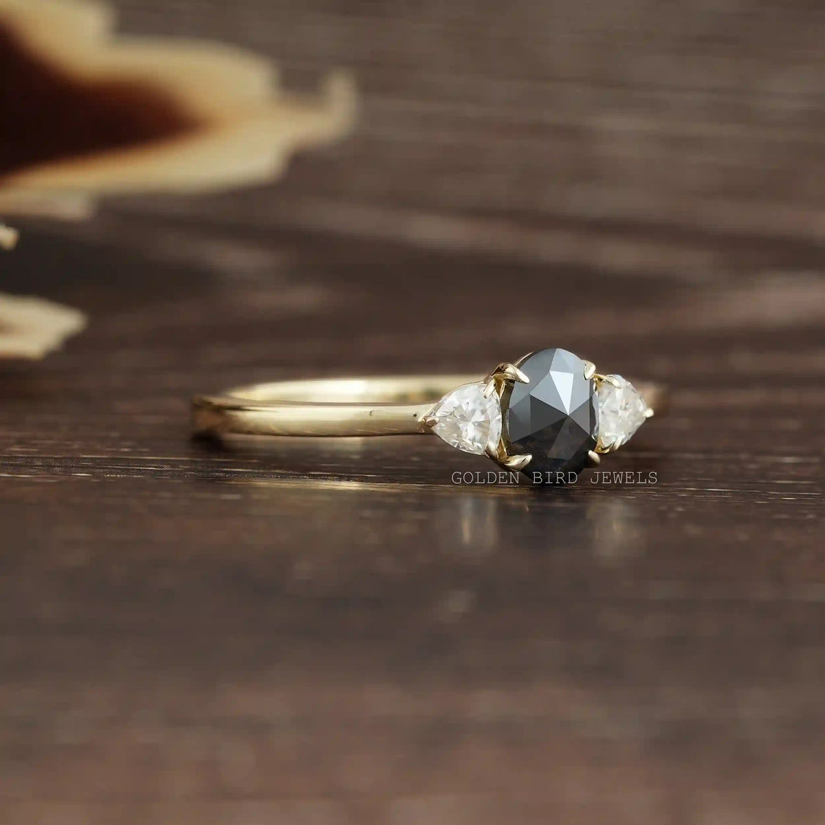 View of 3 Stone Moissanite Oval Cut Engagement Ring In Yellow Gold