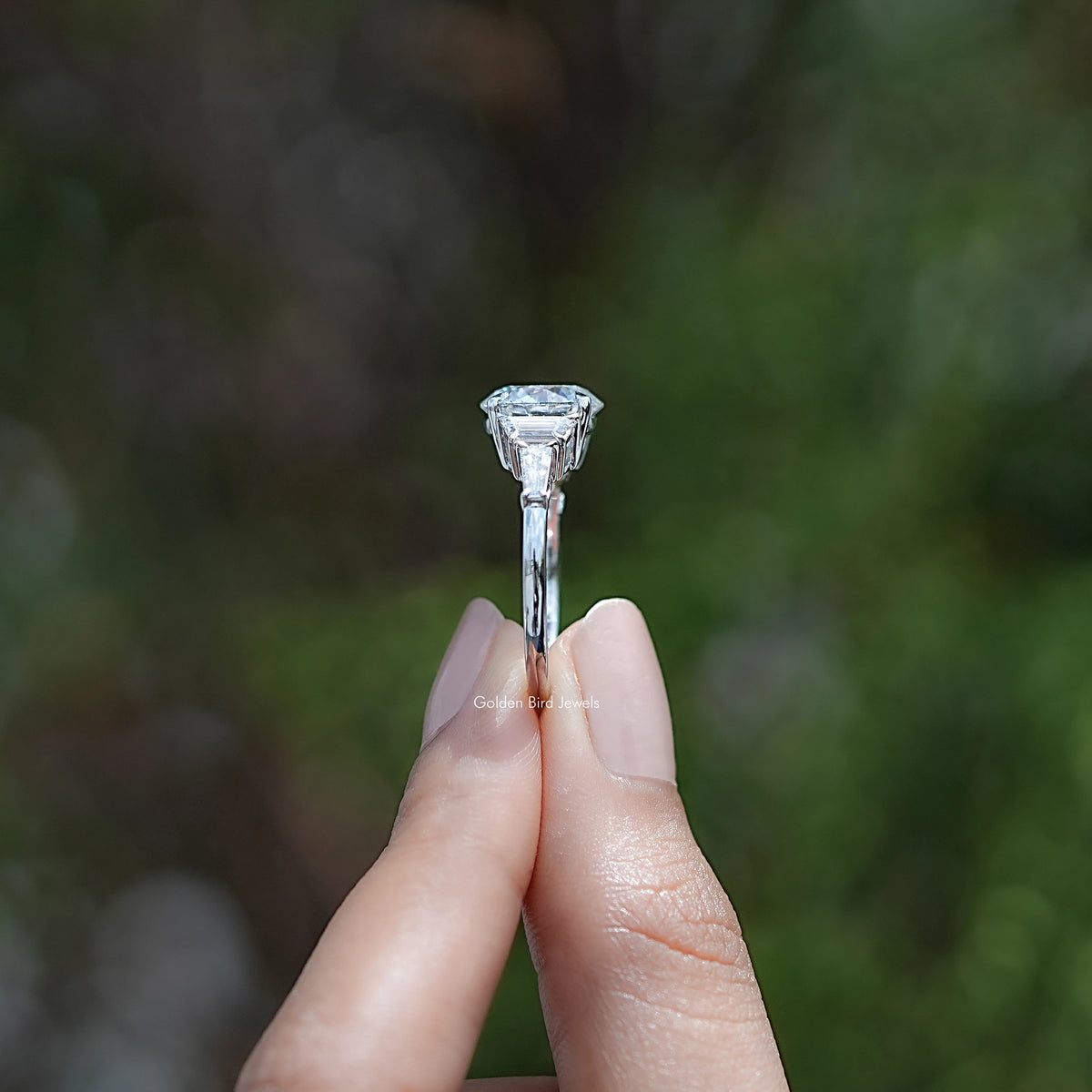 Side View of Round And Step Cut Trapezoid Diamond Ring