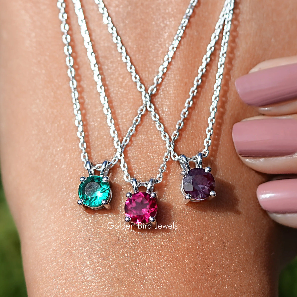 Hand Showing View Of Round Cut Gemstone Solitaire Pendant