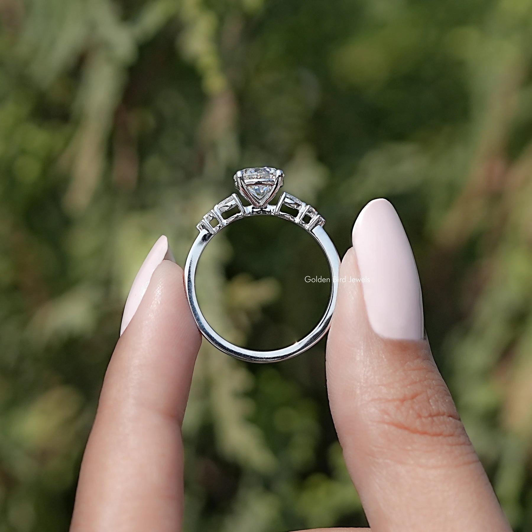 Back view of Round Cut Moissanite Accent Set Engagement Ring in secure setting
