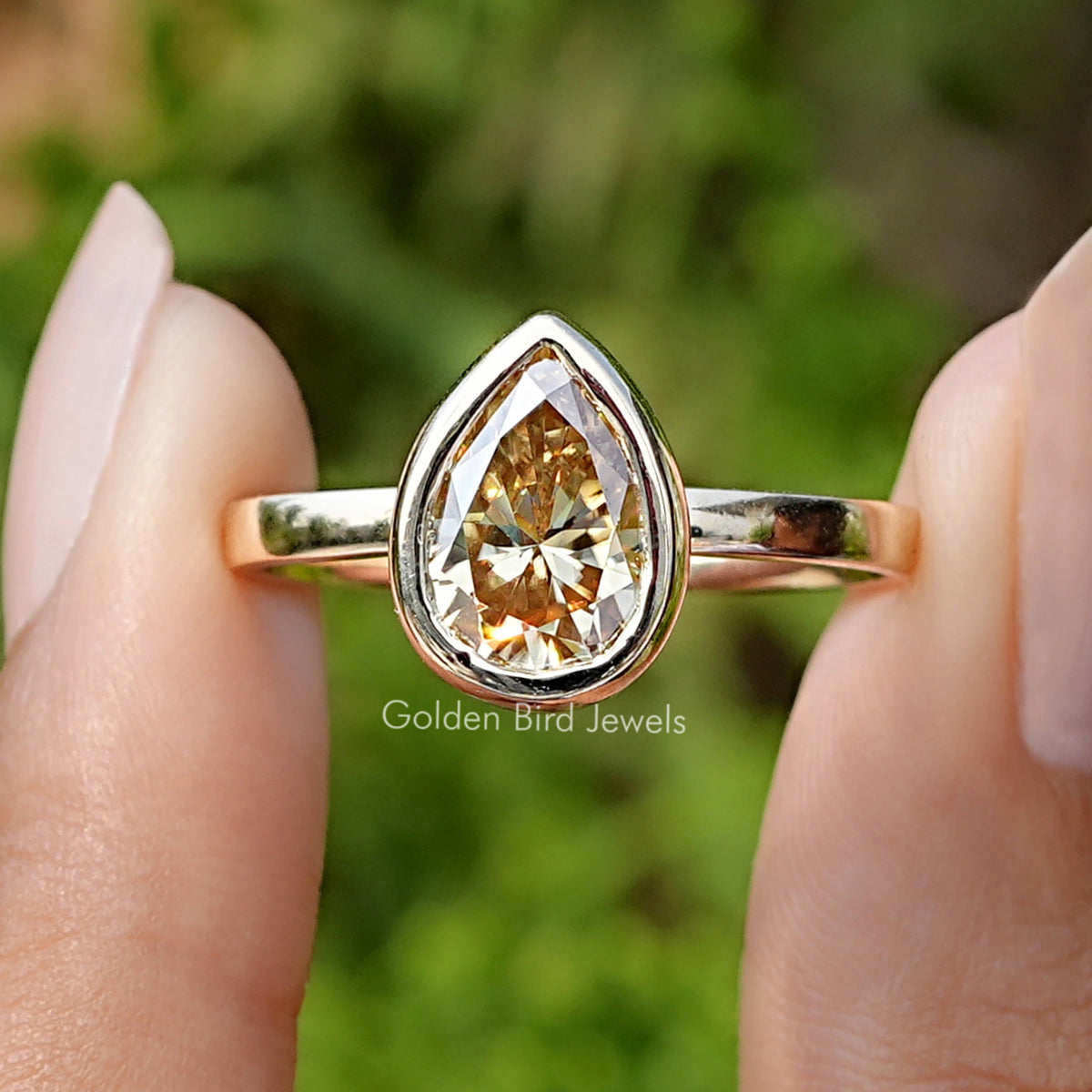 Front view of Pear Cut Yellow Moissanite Bezel Set Solitaire Ring